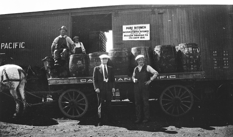 Robert Fitzsimmons (centre) gave bitumen to the Deegan Roofing Company of Calgary in order to promote the product and create a demand for it, n.d.