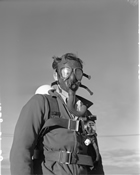 Gas Mask, 1955; by the 1950s, gas masks were mandatory equipment on every rig. The earliest versions, brimmed and made of layered phenalic resin, were similar to those used in the mining industry. This piece of personal safety equipment evolved through later and lighter aluminum and then plastic models. Source: Provincial Archives of Alberta, PA412.10