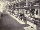 Henry Ford implemented standardization and assembly lines in his automobile manufacturing plants, increasing efficiency and greatly reducing cost, which resulted in an affordable automobile.