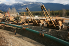 A new pipeline is installed along one of KinderMorgan’s oil pipelines in the Alberta foothills. Through the 1990s, new pipelines were laid, and repairs and upgrades were made to the network of now-aging pipelines across Alberta. 