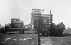 Equipment for the Leduc No. 1 drilling rig being unloaded from a Canadian Pacific Railway car at Leduc; the well site was approximately 20 km (12 mi.) by road from the town of Leduc.