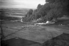 This aerial view shows the fire at the Atlantic No. 3 well, near Devon, 1948, that burned for months before being brought under control and extinguished. The surrounding farm land remained unusable fifty years after the incident.