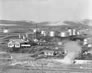 In this  panoramic view of the Royalite gas plant, Turner Valley, Alberta, the Horton spheres, top left, are surrounded by storage tanks and other plant structures, February 15, 1944. <br/>Source: Provincial Archives of Alberta, P2518