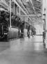 This interior of the Madison Natural Gas compression plant shows the back of the bank of Cooper-Bessemer compressors, ca. 1945 <br/>Source: Glenbow Archives, IP-14a-900