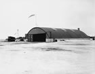The Rutledge Air Service hangar, Renfrew airfield (later Stanley Jones Airport), Calgary, ca. 1929; in 1929, Wilfred Rutledge, chief instructor of the Calgary Flying Club, started an air travel service between this airport and a grass airstrip near Turner Valley. <br />Source: Glenbow Archives, NA-3884-12