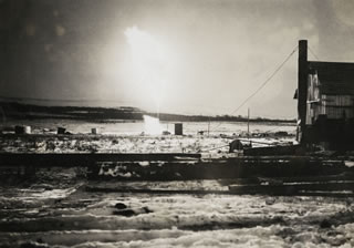 Royalite No. 4 in Turner Valley, a sour gas well, results in a major blowout that destroys the derrick. The fire burns for three weeks until a team of experts from Oklahoma uses dynamite and steam to extinguish the flames. <br />Source: Glenbow Archives, IP-6e-4-18