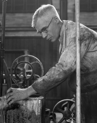 Karl Clark at work on his prototype separation plant, 1929, Source: Glenbow Archives, ND-3-4596a