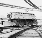 A battery locomotive at Western Monarch Mine in Drumheller Valley at the end of the 1940s: after 1930, locomotives became more commonly used in underground mines to haul loaded coal wagons to the surface.