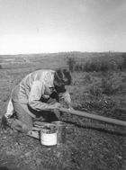 Pollyanna Powell glues two sections of pipe together. With their application approved in late October 1962, the Meota group had to hurry to install their own pipeline system before winter struck. All family members in the district pitched in, selling contracts, obtaining easements, digging trenches and wrapping pipes. Source: Courtesy of Gwen Blatz