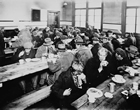 People eating at a soup kitchen, 1931; at the depth of the Depression in Canada in 1933, unemployment had reached twenty-seven percent. For many, soup kitchens offered the only possibility of eating. Source: Library and Archives Canada / PA-168131