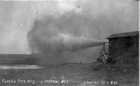 An oil and gas mixture blows from the Fabyan No. 2 (Imperial No. 1) well in the Wainwright oil field.