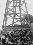 Drilling rig near Petrolia, Ontario, n.d.; dozens of drilling rigs like this were erected in Lambton County in a frantic bid to reach the oil reserves. Although the region had a promising start, the reserve was small, and many wells and companies failed.