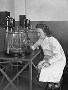 An unidentified female researcher working in an Imperial Oil laboratory, Sarnia, Ontario, 1943; perhaps aided by the shortage of male labour during the Second World War, opportunities for women with specialized training began to open up through the 1940s.