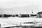 Residential area of Royalties (also known as "Little Chicago"); a mixture of shacks and simple mass-produced homes was all that provided shelter for many oil-field workers and their families in the rough early oil-field communities.<br/>Source: Glenbow Archives, NA-2895-5