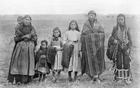 Life on the reserves was difficult for Canada’s indigenous peoples such as these Cree women and children near Maskwacis (formerly known as Hobbema), ca. 1890s.  They tried to adopt an agricultural lifestyle on land that they did not own or control—land that often was not suited for agriculture. Poverty was common throughout the reserves.