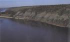 An outcrop of the Athabasca Oil Sands deposit along the Athabasca River valley; only about 10% of the Athabasca deposit can be accessed through surface mining. The other 90% requires in situ extraction methods. Source: Courtesy of Alberta Innovates