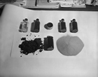 Samples of Alberta oil sands before and after bitumen separation from sand and clay solids, Calgary, December 1954. Source: Glenbow Archives, NA-5600-6008a