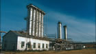 Scrubbing plant (built 1935) with two Girbotol towers (added later) on the right, Turner Valley Gas Plant Historic Site, 2002; in this plant, chemicals and high pressure were used to remove hydrogen sulfide to make the gas safe for consumer use. <br />Source: Alberta Culture and Tourism, Grab 001