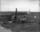 View of Calgary Petroleum Products’ Dingman Nos. 1 and No. 2 wells, 1914; following the success of the first well, expectations of profit were high when the second well was brought in, which fueled increased speculation and investment. <br />Source: Provincial Archives of Alberta, P1304
