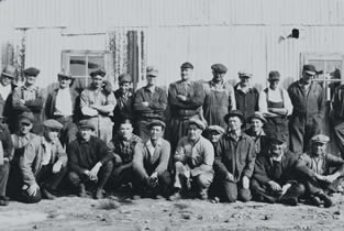 Oil well workers pose for a photo, late 1920s