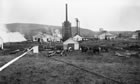 The construction of the towers for the scrubbing plant at the Turner Valley gas plant, 1925; the equipment removes dangerous hydrogen sulfide from the gas. <br />Source: Glenbow Archives, NA-711-39