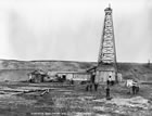 Dingman No. 1 well, 1914; half of the walking beam is clearly visible above the roof of the drill shack. The other half extended over the drilling floor, with the end directly over the well. <br />Source: Glenbow Archives, NA-952-2