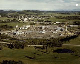 In 1985, following years of declining production and rising costs for maintenance and upgrading, the Turner Valley gas plant is deemed to be no longer economically viable and is decommissioned. <br />Source: Alberta Culture and Tourism