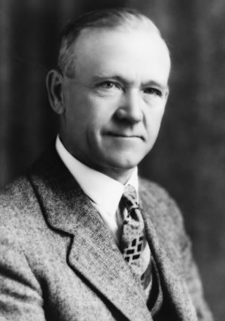 William Stewart Herron, shown here ca. 1930, noticed gas seepages along the Sheep River and acquired land and drilling rights for the area. He partnered with Archibald W. Dingman and a group of Calgary-area investors to form Calgary Petroleum Products and began drilling in Turner Valley in 1913. <br />Source: Glenbow Archives, NA-4607-1.